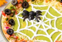 Spiderweb 7-Layer Dip Recipe for Halloween Parties