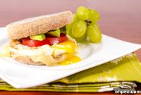 Egg, Avocado, and Tomato Breakfast Sandwich with Swiss