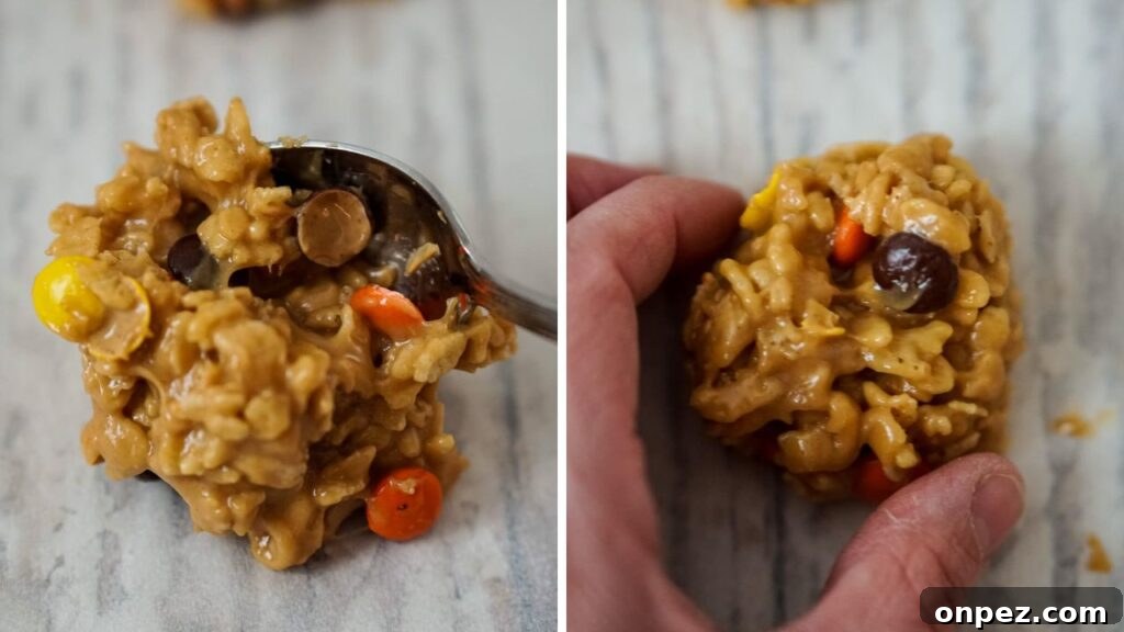 No-Bake Rice Krispies Cookies Recipe 7 A spoonful of the cookies mixture is place onto a baking sheet covered with parchment paper. A person then shaped the mixture into a ball with their fingers.