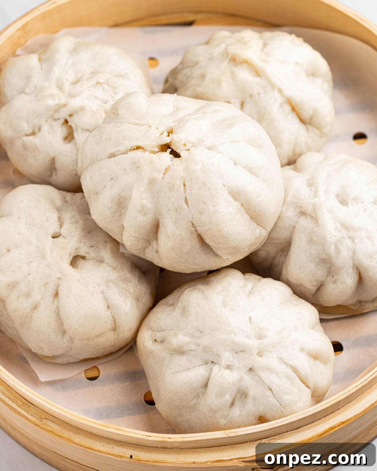 Banh baos stacked in a steamer.