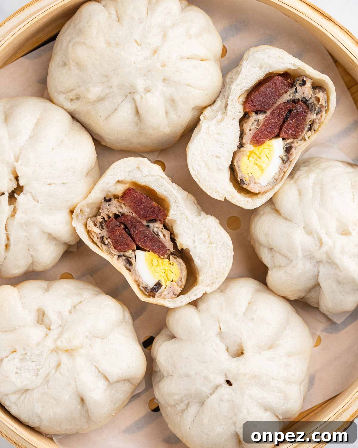 Close up of banh baos and a cross section of one of them.
