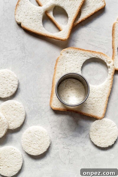 Creamy Egg Salad Tea Sandwiches Recipe 7 Cutting bread with a cookie cutter.