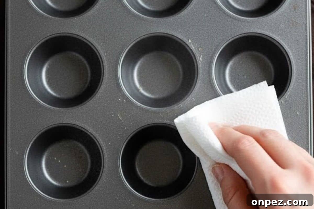 Set your oven to 350°F (175°C) and spray a 24-count mini muffin tray with cooking spray. Wipe away excess with a paper towel.
