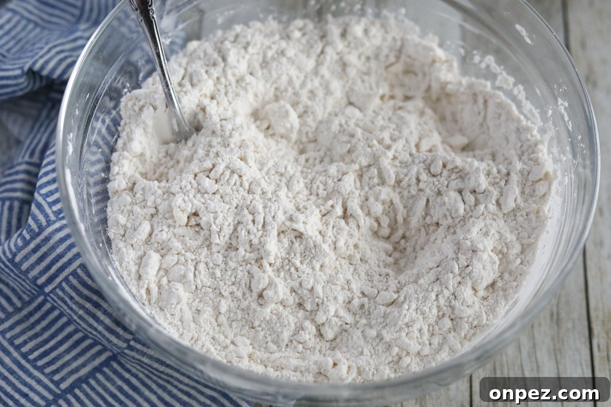 Flaky Homemade Buttermilk Biscuits from Scratch 4 butter and self-rising flour combined into a crumbly dough