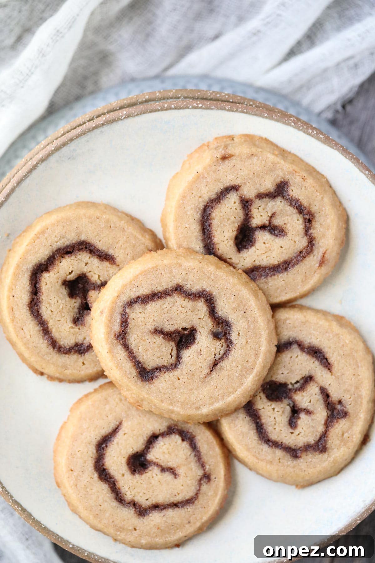 cinnamon roll cookies on a gray plate.