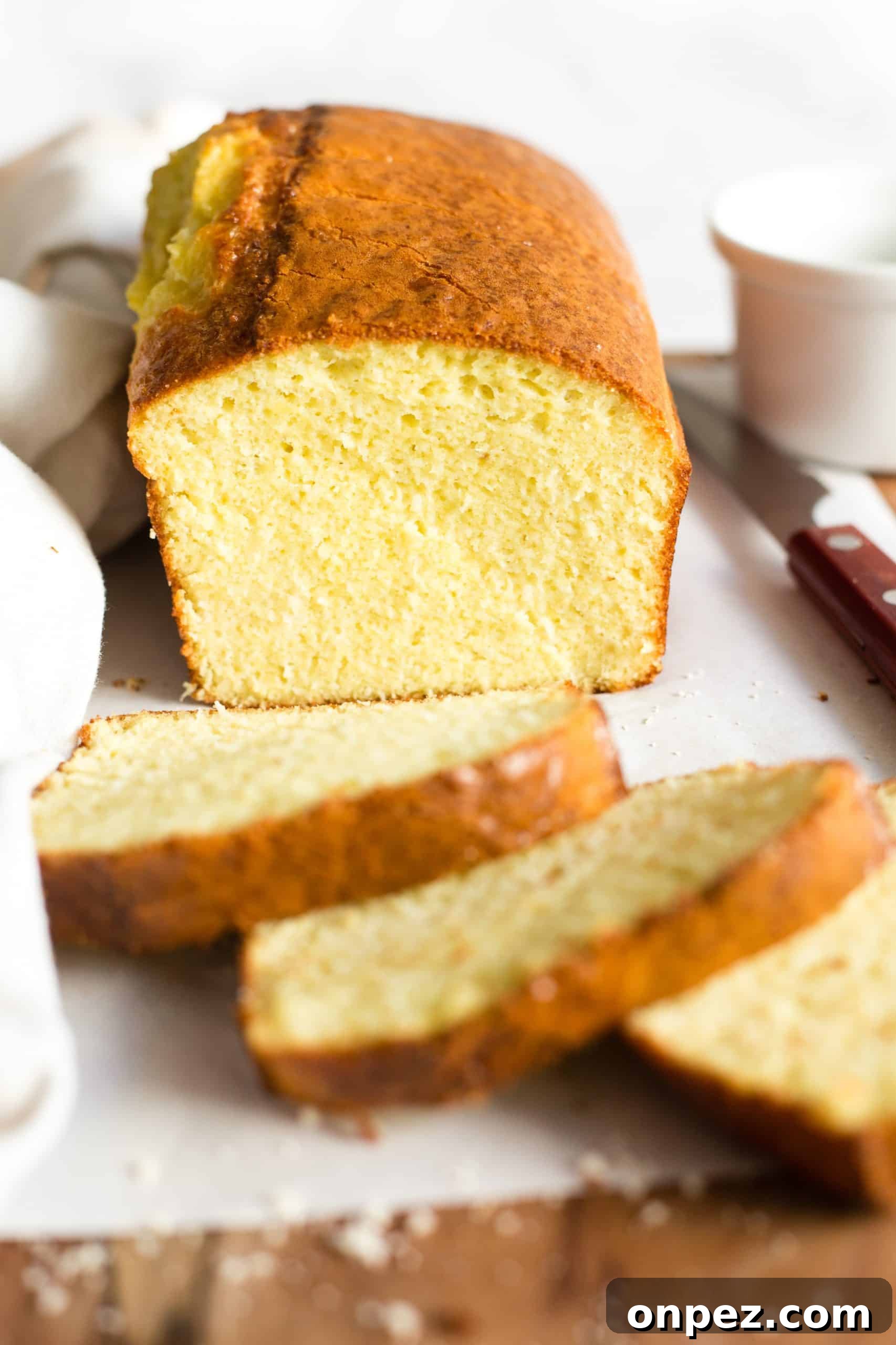 Close up of the texture of a sliced loaf of almond bread.