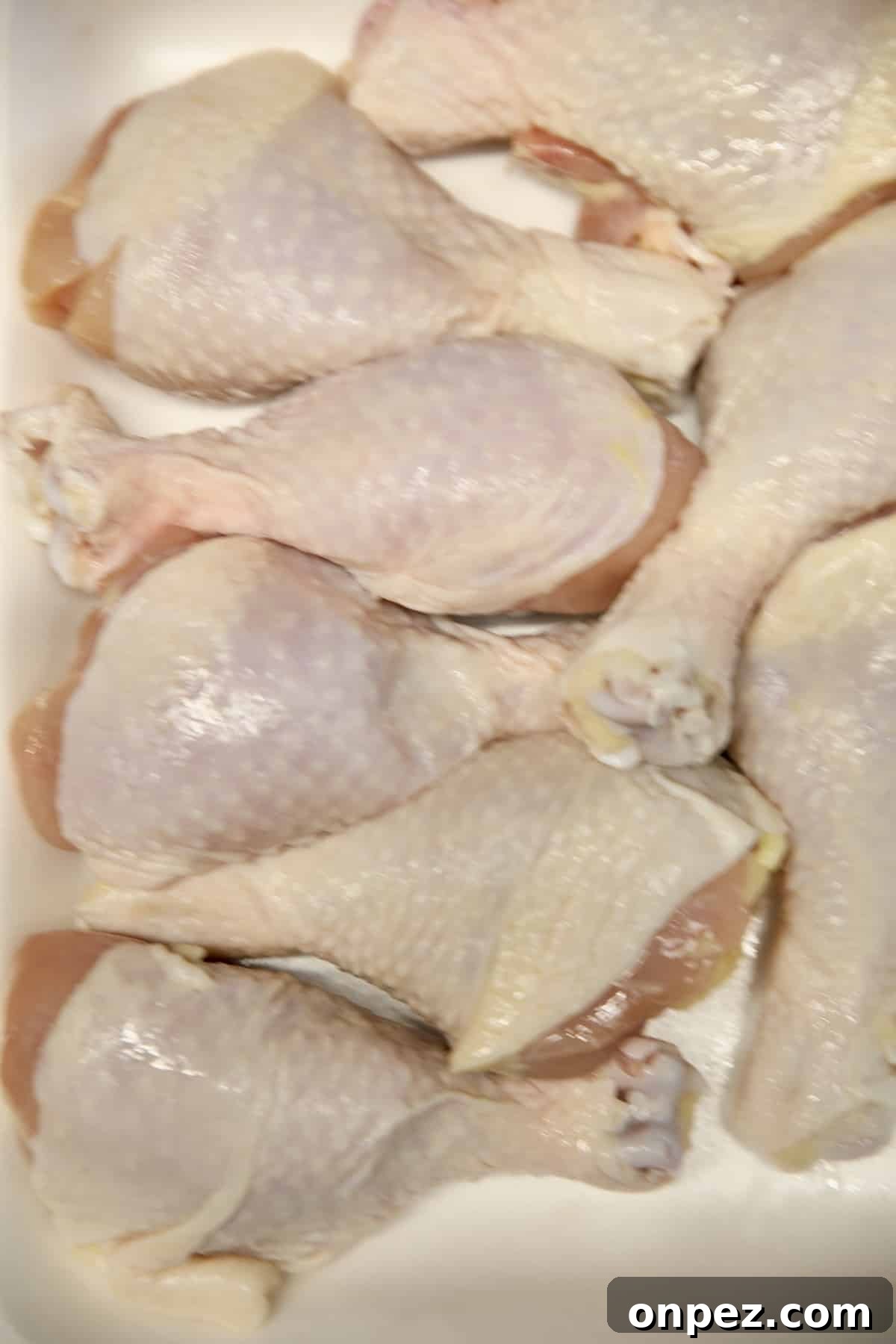 Raw chicken drumsticks.