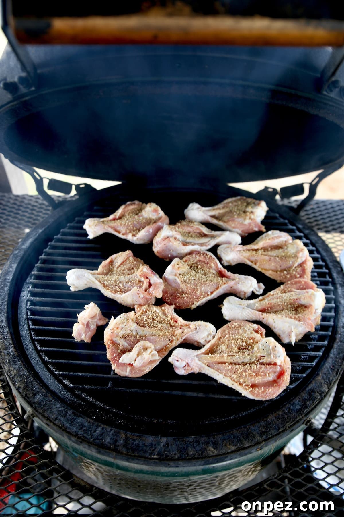 Chicken legs on a grill.