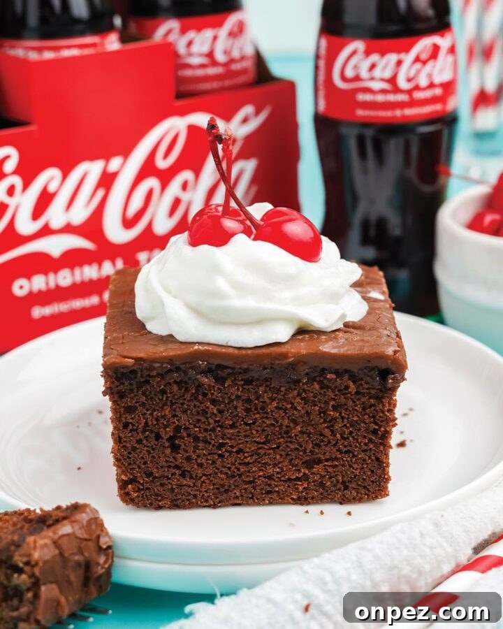 Quick Lemon Dump Cake Recipe 8 Slice of coca cola cake topped with whipped cream and a cherry.