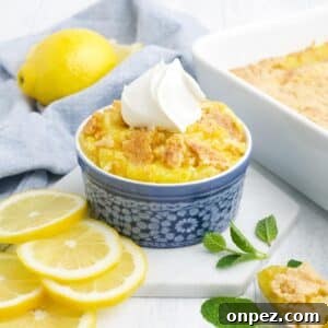 Quick Lemon Dump Cake Recipe 10 A bowl of lemon dump cake topped with whipped cream.