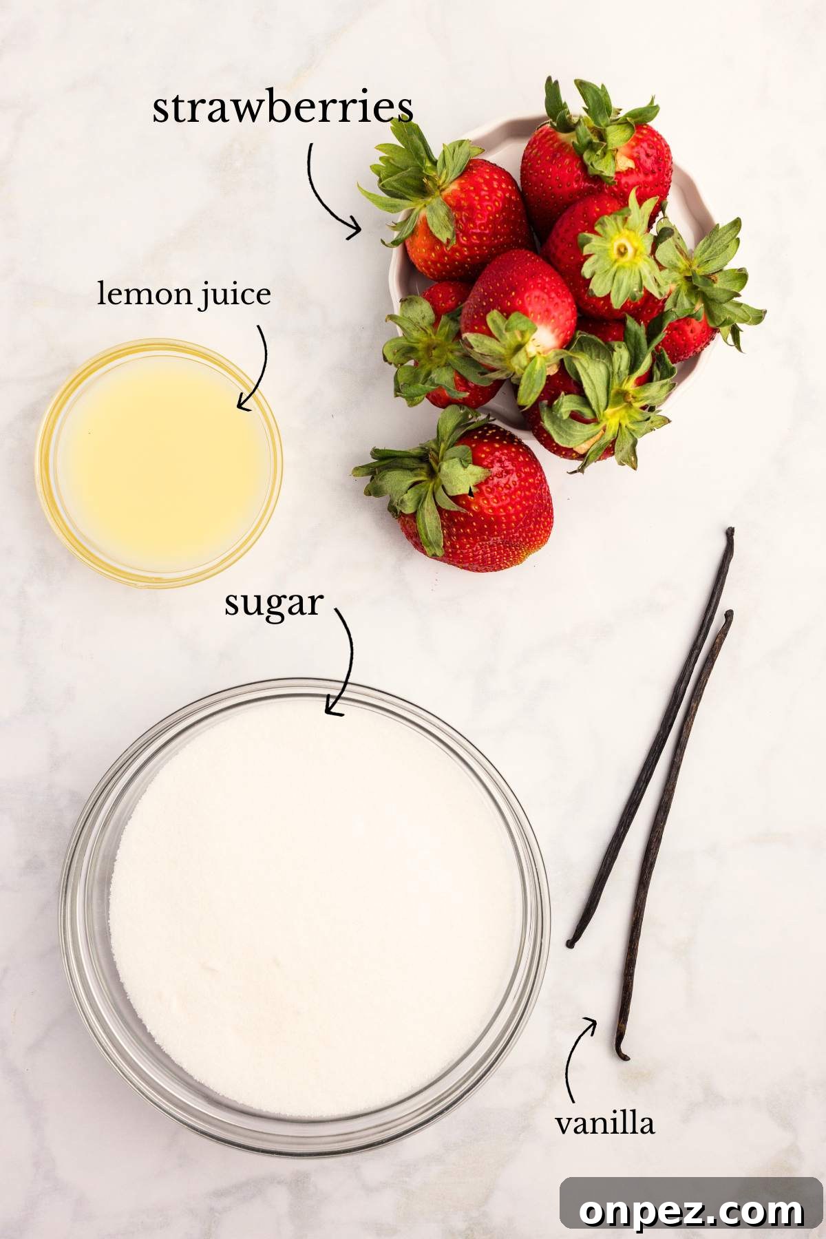 Homemade Strawberry Butter Canning Recipe and Tips 3 Labeled ingredients for strawberry butter: lemon juice, strawberries, sugar, and vanilla beans.