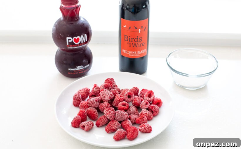 Sangria Popsicle Recipe: Refreshing Wine Pops for Summer 4 Ingredients needed for raspberry sangria popsicles.