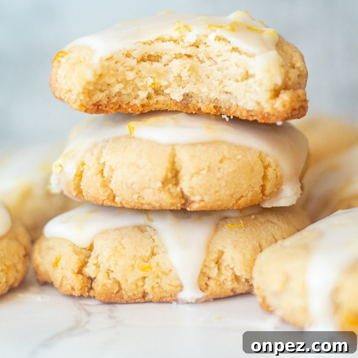 closeup of almond lemon cookies with a bite taken out