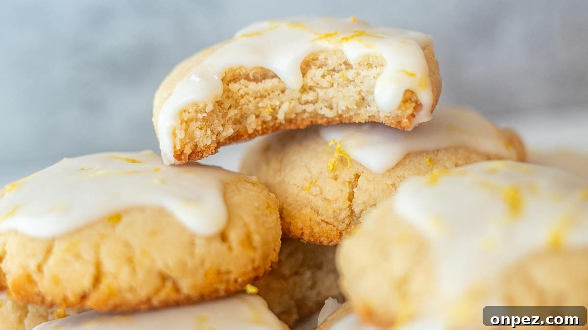 closeup of almond lemon cookies with a bite taken out