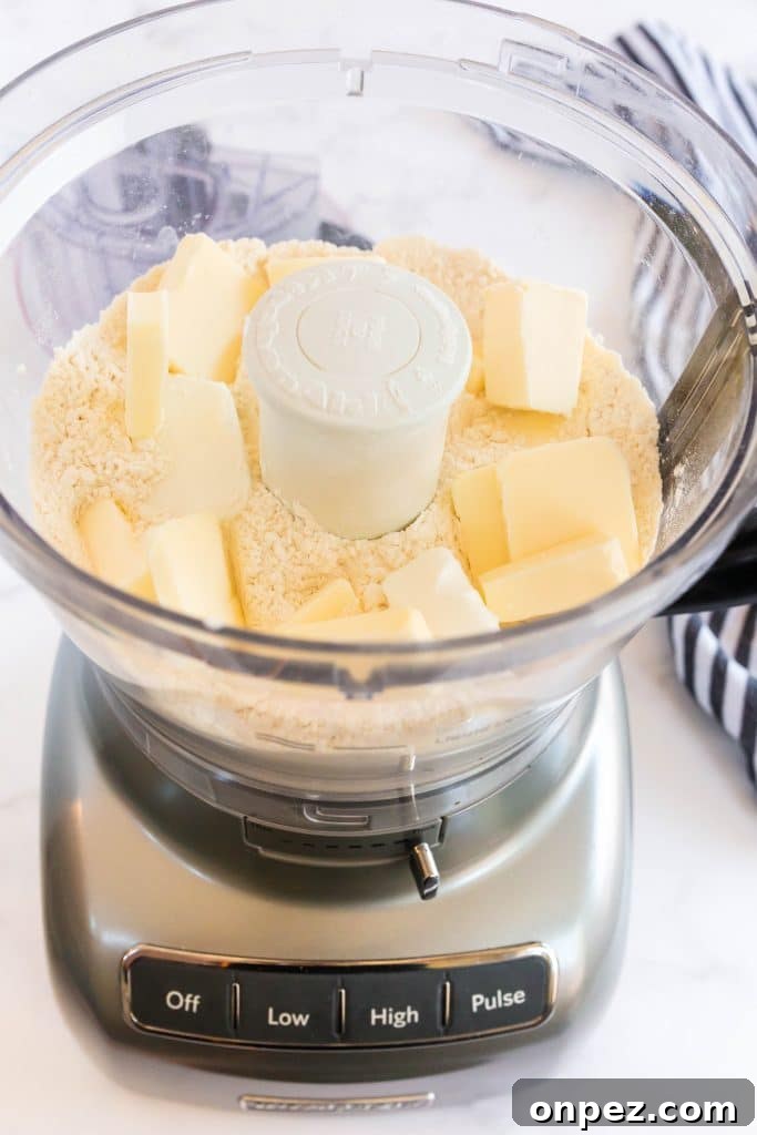 Perfect Homemade Pie Crust Recipe: Flaky and Foolproof 8 adding cold butter cubes to the dry ingredients.