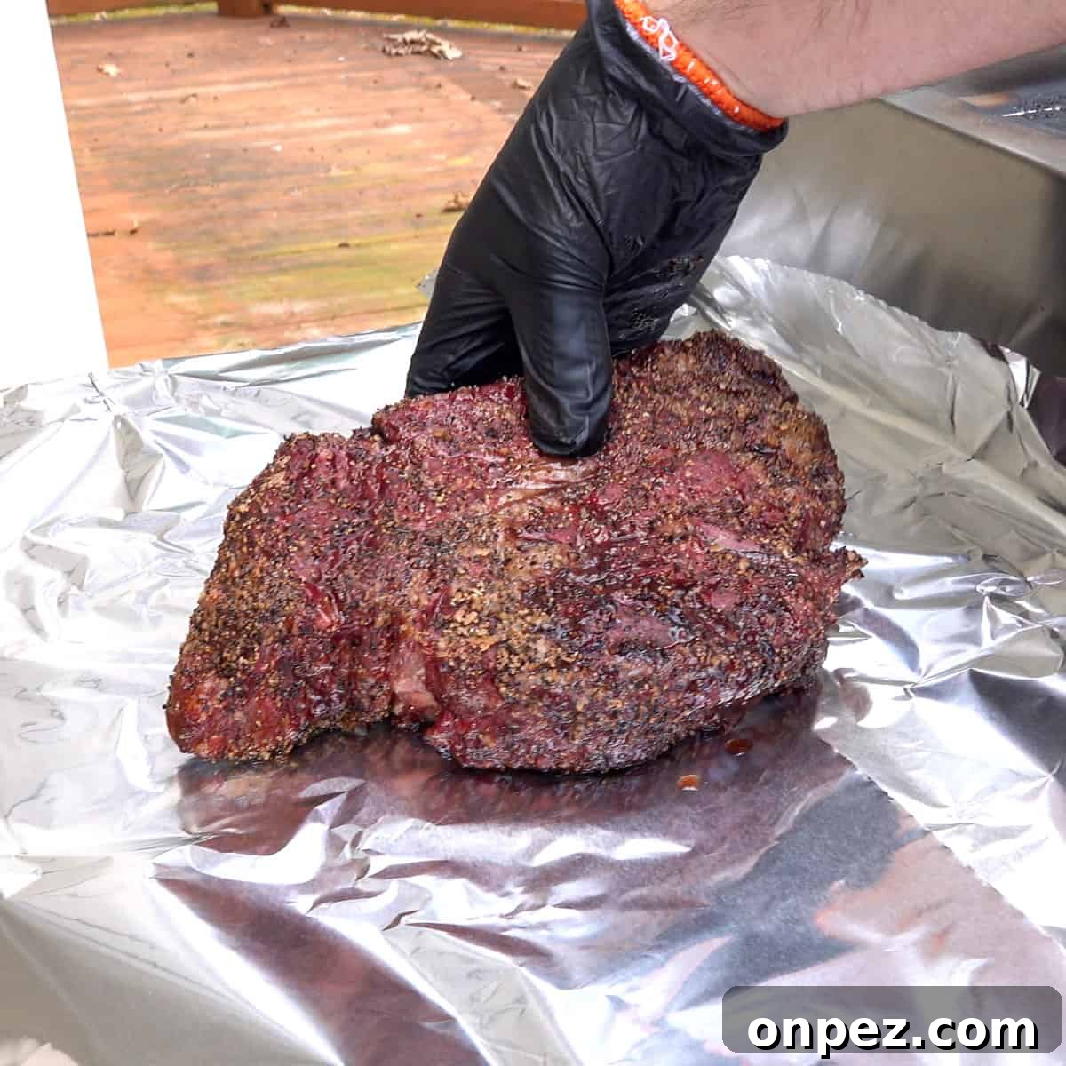 Budget Burnt Ends: Incredibly Tender Brisket Bites 4 Smoked chuck roast being placed on aluminum foil