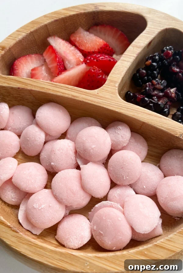 Strawberry banana yogurt melts served with sliced strawberries and blackberries