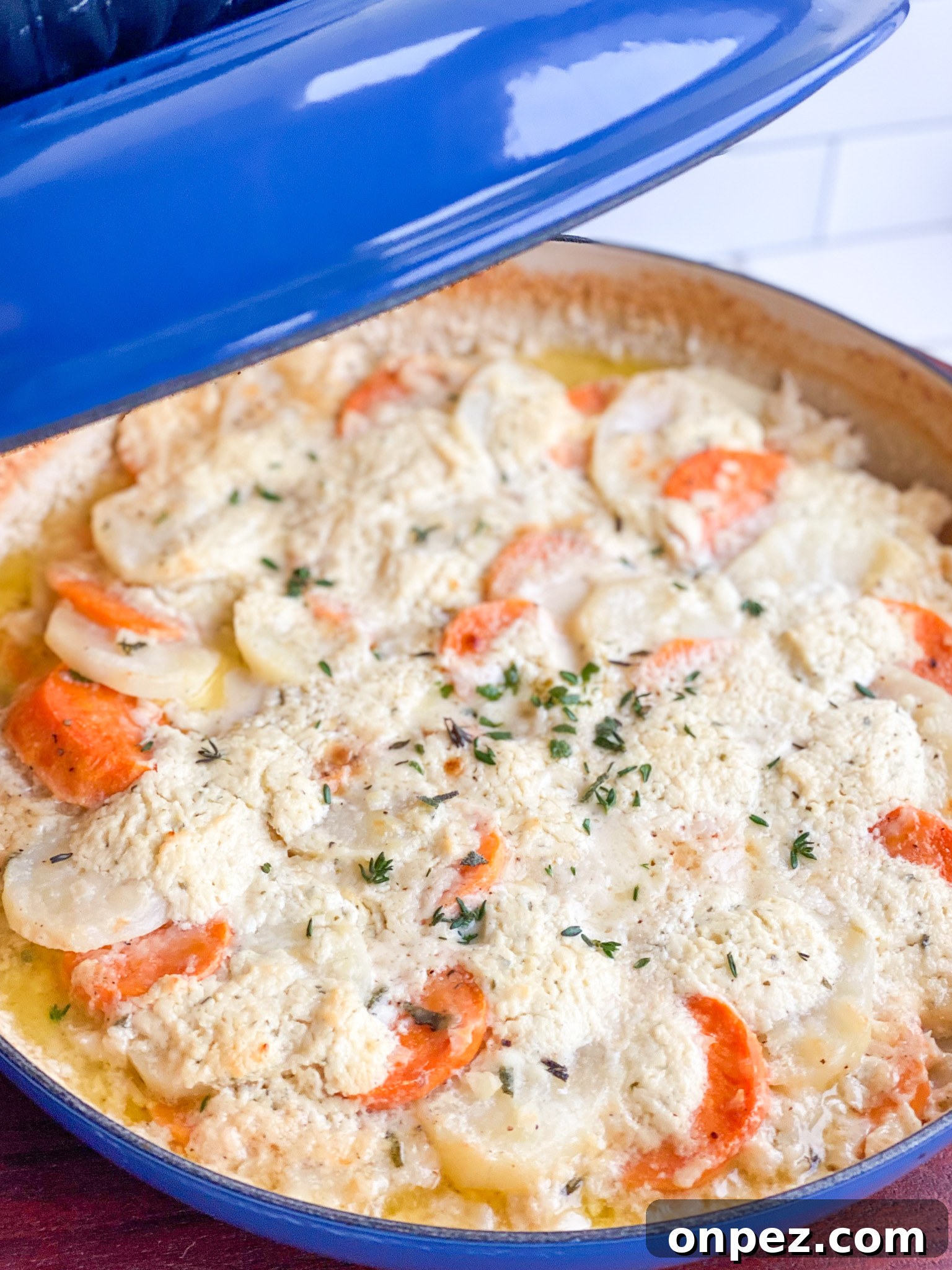 Scalloped Yukon Gold and Sweet Potato Gratin 3 Creamy scalloped Yukon Gold and sweet potatoes in a skillet