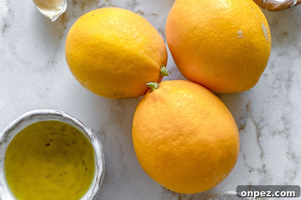 Bright Lemon Vinaigrette for Salads & Marinades 4 ingredients for lemon dressing against a white background