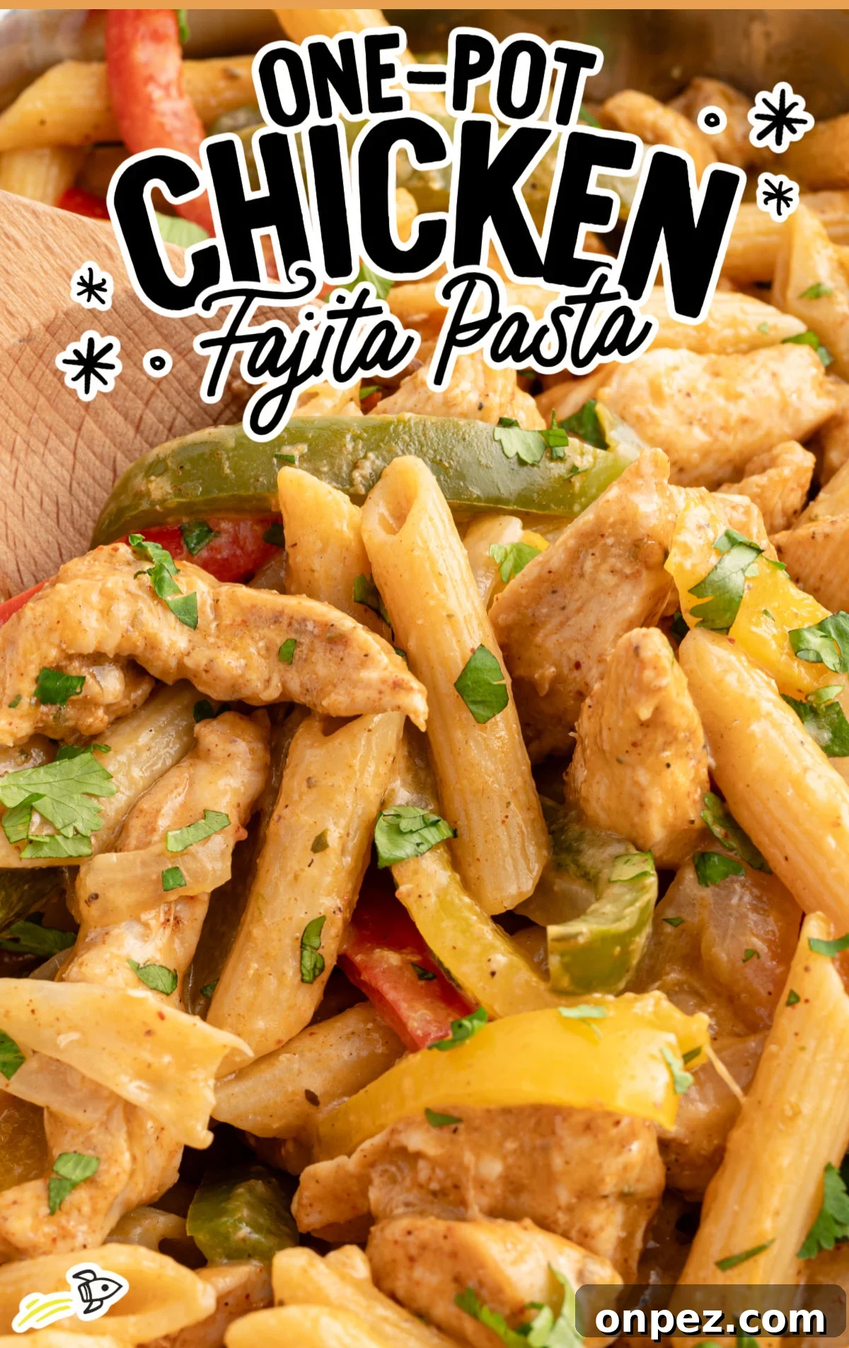 One-Pot Chicken Fajita Pasta Recipe 2 Close-up of creamy one-pot chicken fajita pasta featuring penne, tender chicken strips, and sautéed red, yellow, and green bell peppers, all coated in a spiced sauce and garnished with fresh cilantro. Bold text overlay reads “One-Pot Chicken Fajita Pasta.