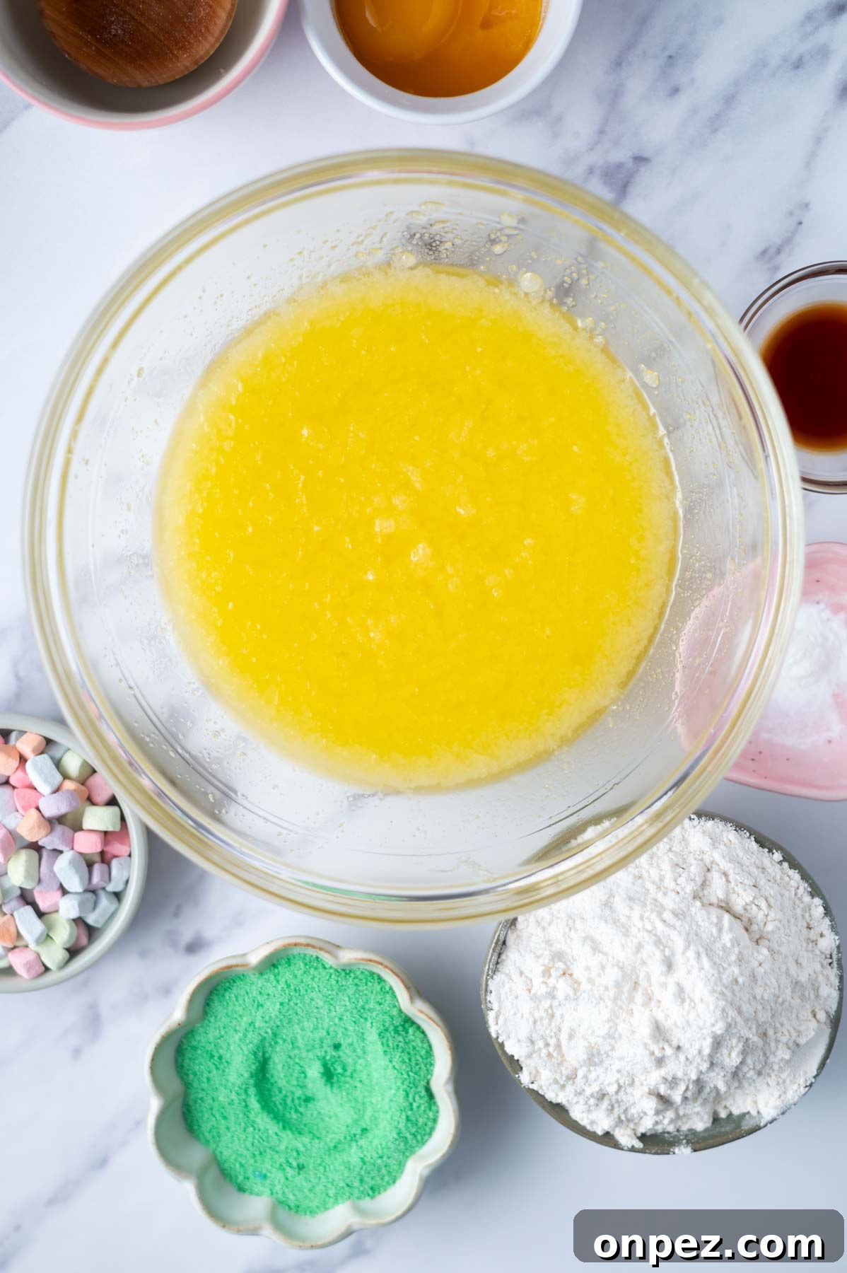 St Patricks Day Sugar Cookies with Festive Green Icing 5 melted butter and sugar mixed in a bowl