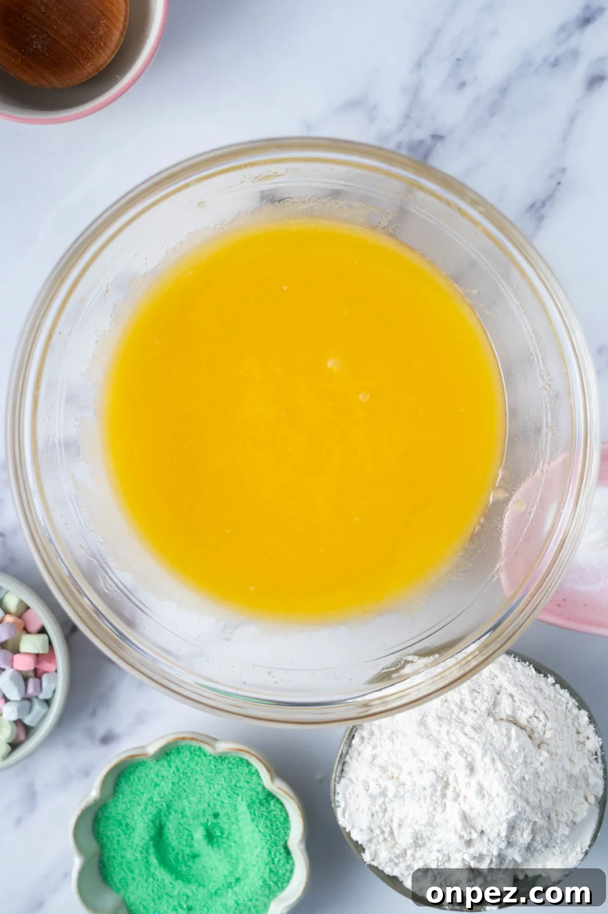 St Patricks Day Sugar Cookies with Festive Green Icing 6 melted butter, sugar, eggs and extracts mixed together in a glass bowl