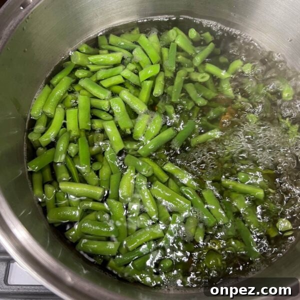 How to Freeze Green Beans for Freshness All Year 5 cut green beans boiling in pot