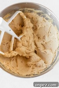 Butter and sugar creamed together in the bowl of a stand mixer.