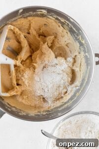 Dry ingredients added to the bowl to make cookie dough.