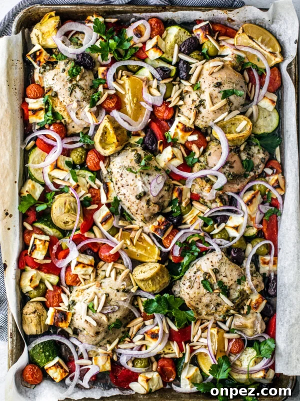Sheet Pan Turkey Sausage with Roasted Peppers 9 Overhead shot of sheet pan covered with roasted veggies, chicken, and feta.