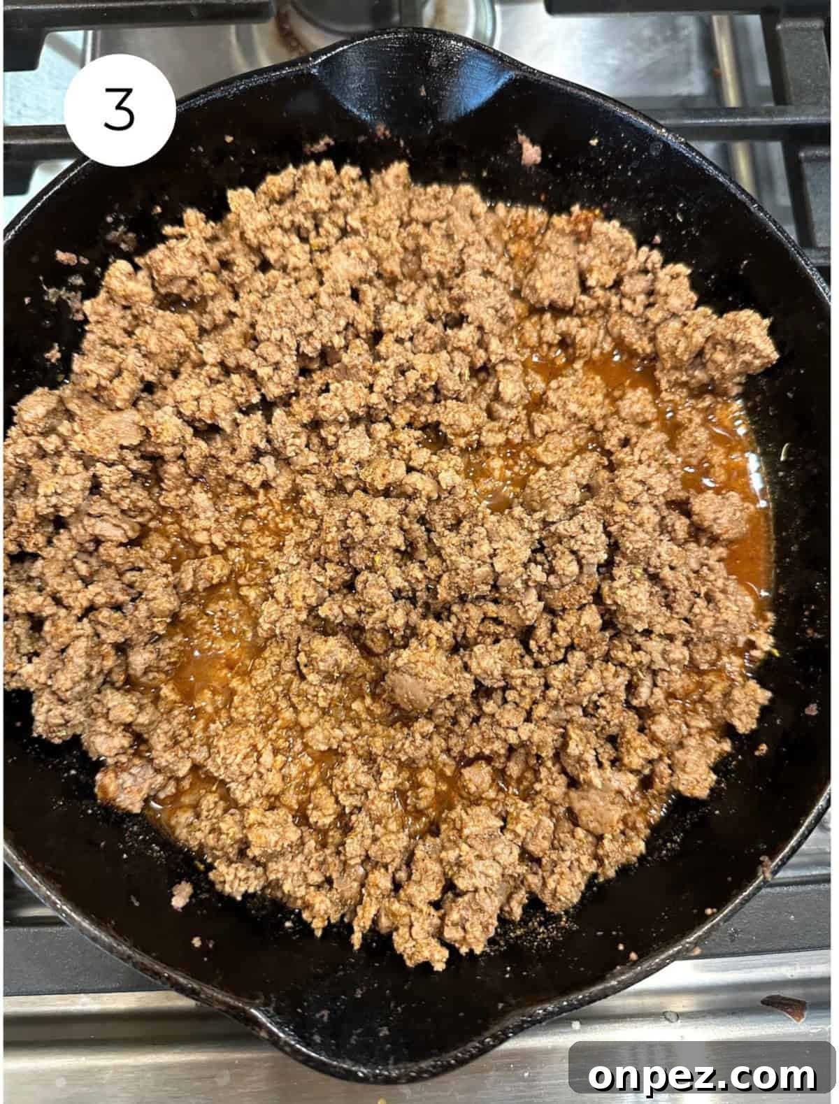 DIY Taco Seasoning Mix: Homemade Spice Blend 7 Cooked beef with taco seasoning in a skillet on the stove.
