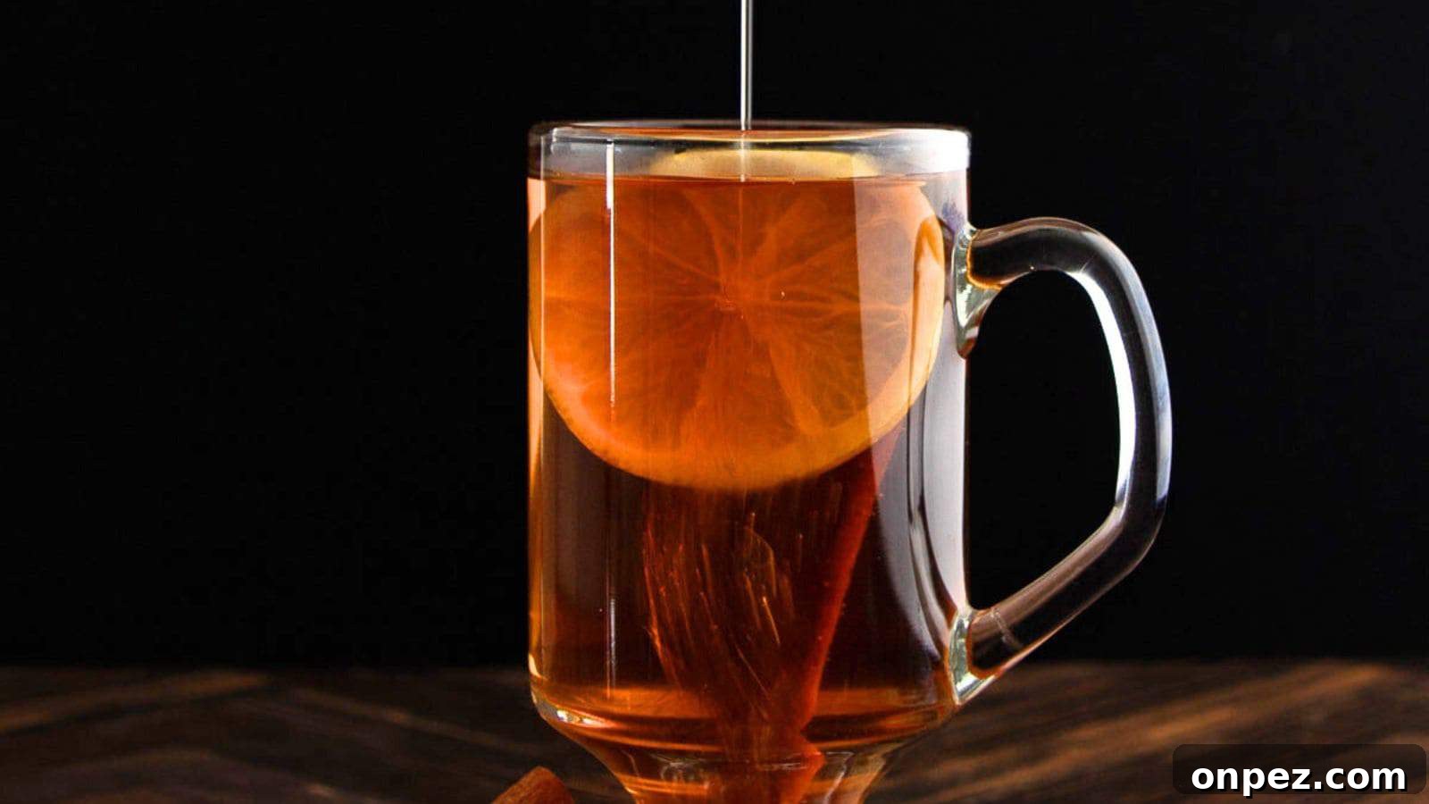 Cozy Non-Alcoholic Winter Drinks and Hot Mocktails 7 Non-alcoholic hot toddy in a glass