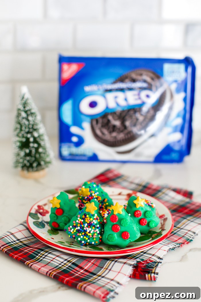 Christmas Oreo Truffles: Festive No-Bake Cookie Balls 5 OREO balls shaped into trees dipped in green chocolate decorated with sprinkles