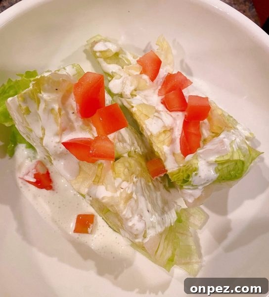 Salad dressing over the lettuce wedges