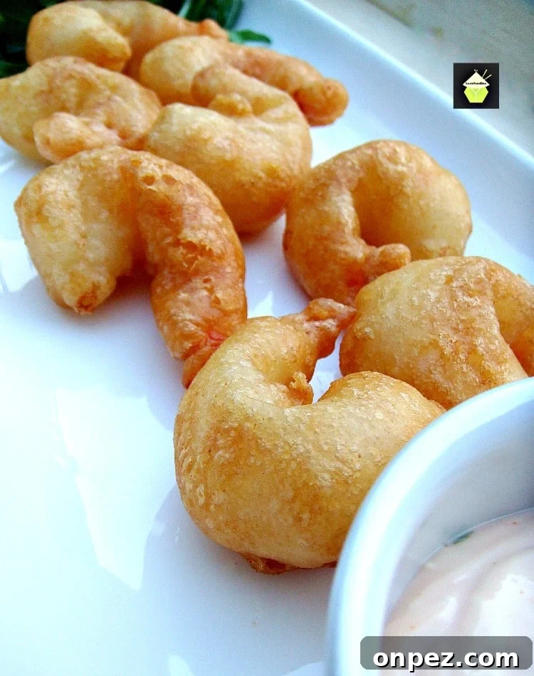 Crispy Beer Battered Shrimp. Light and crispy batter around delicious juicy shrimp, add your favorite dip and these are a perfect starter or party food.
