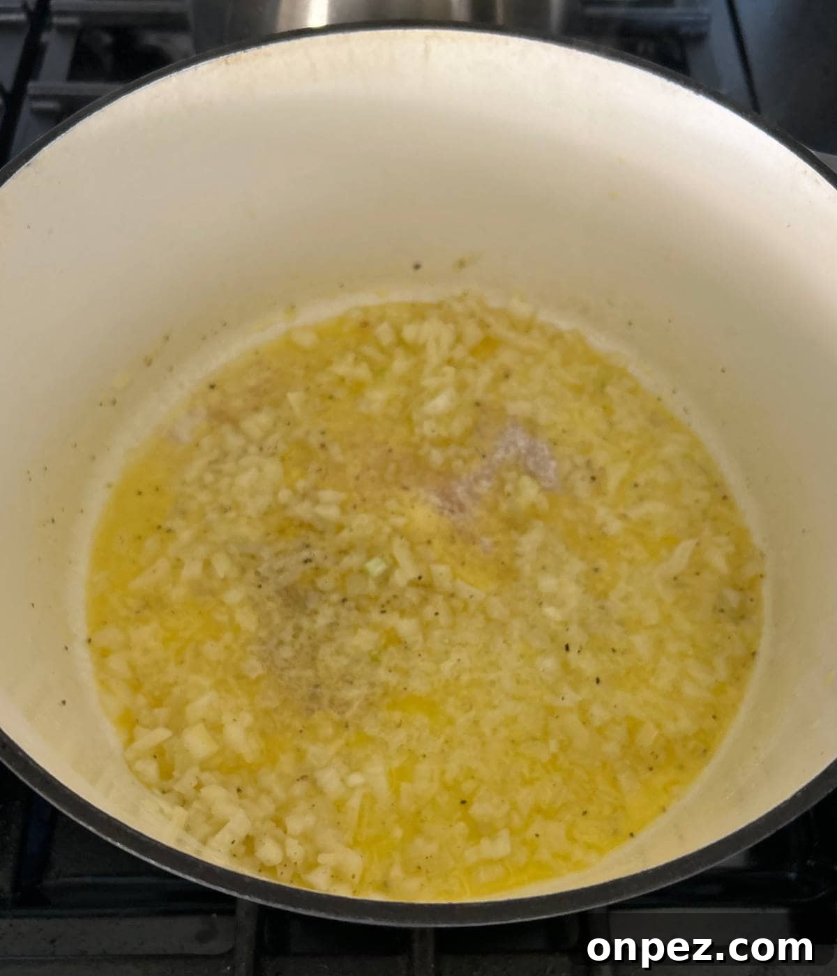 Creamy Chicken and Broccoli Cheddar Soup Recipe 4 Melted butter in pot with onion.