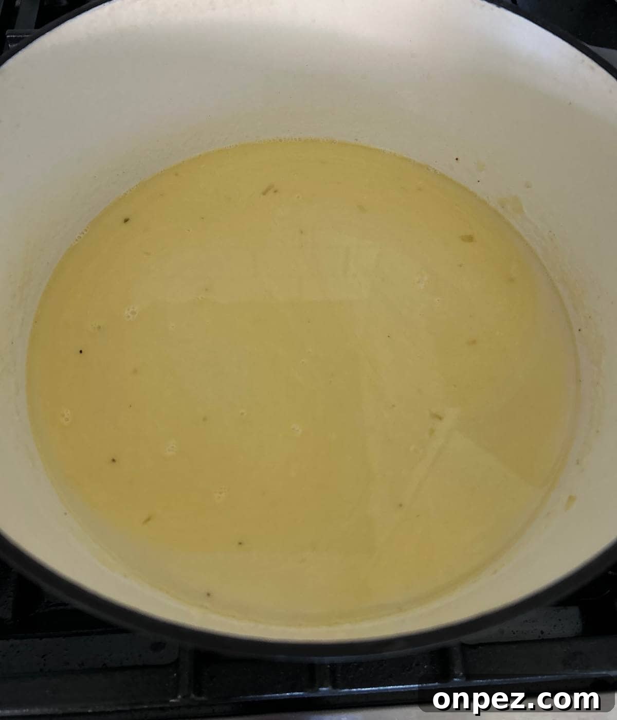 Creamy Chicken and Broccoli Cheddar Soup Recipe 6 Stock in pot.