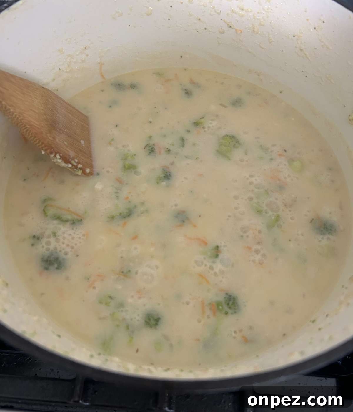 Creamy Chicken and Broccoli Cheddar Soup Recipe 8 Broccoli cooking in creamy stock.