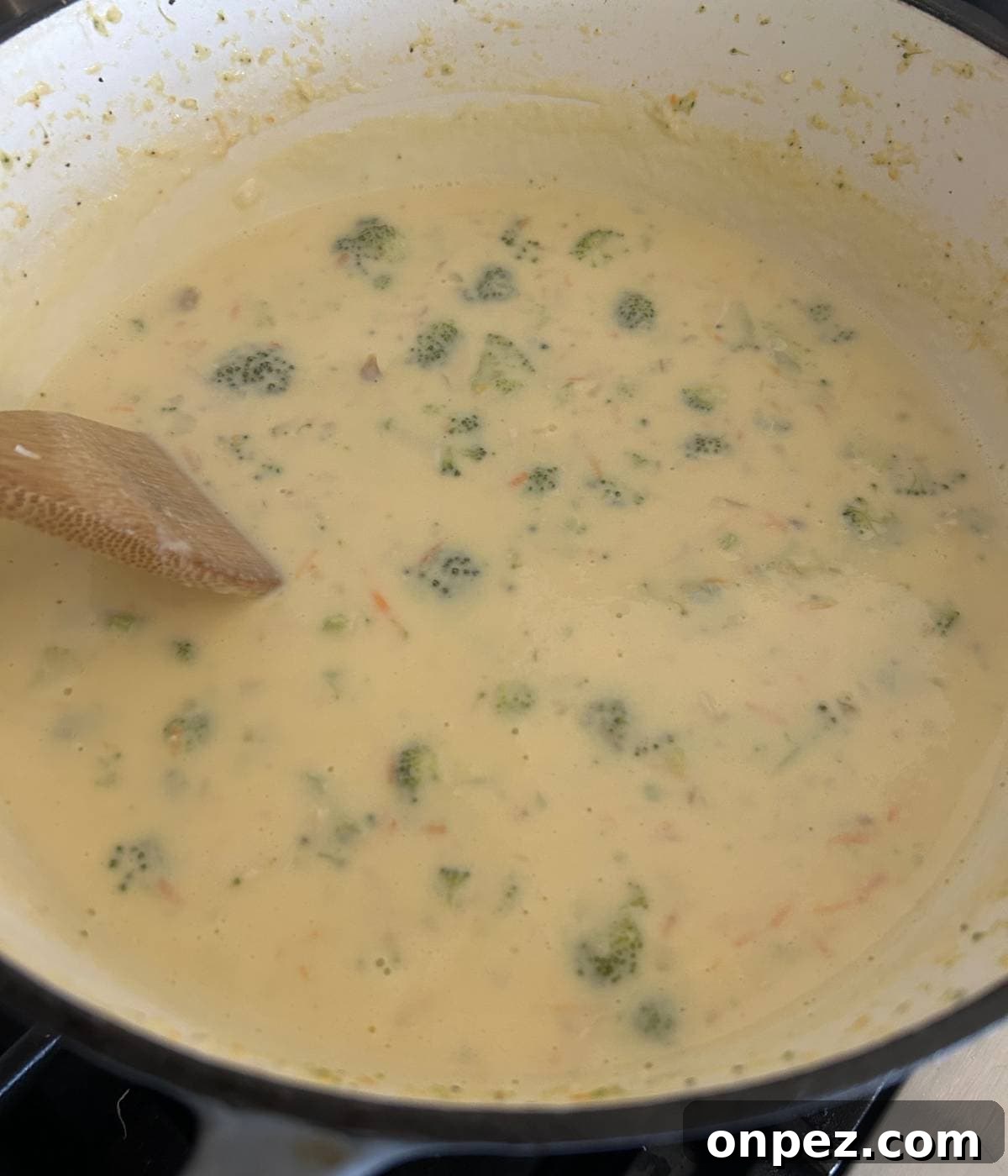 Creamy Chicken and Broccoli Cheddar Soup Recipe 9 Chicken broccoli cheddar soup in pot.