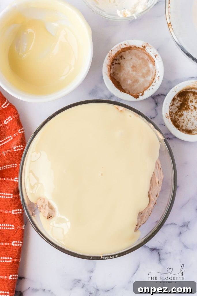 Whipping cream to stiff peaks for mousse.