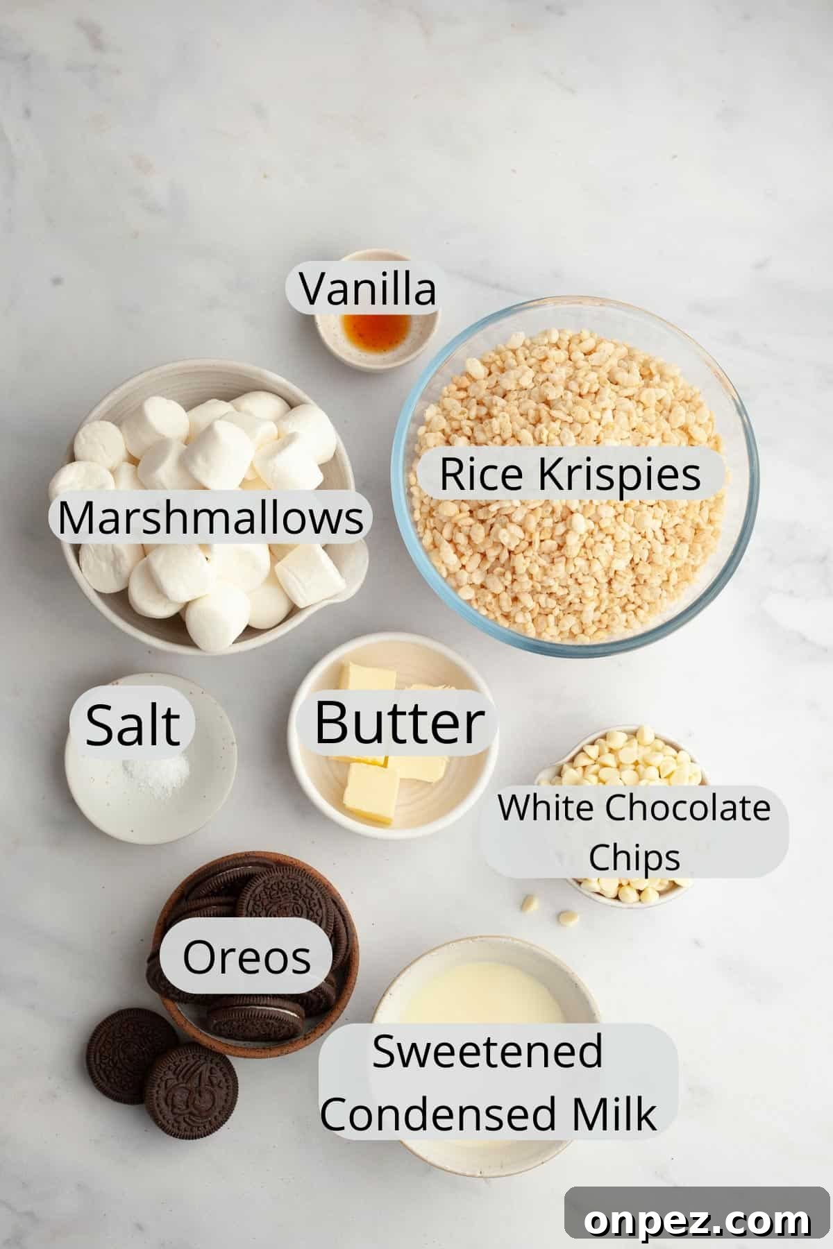 All the ingredients needed to make Oreo rice krispie treats, weighed out into small bowls.