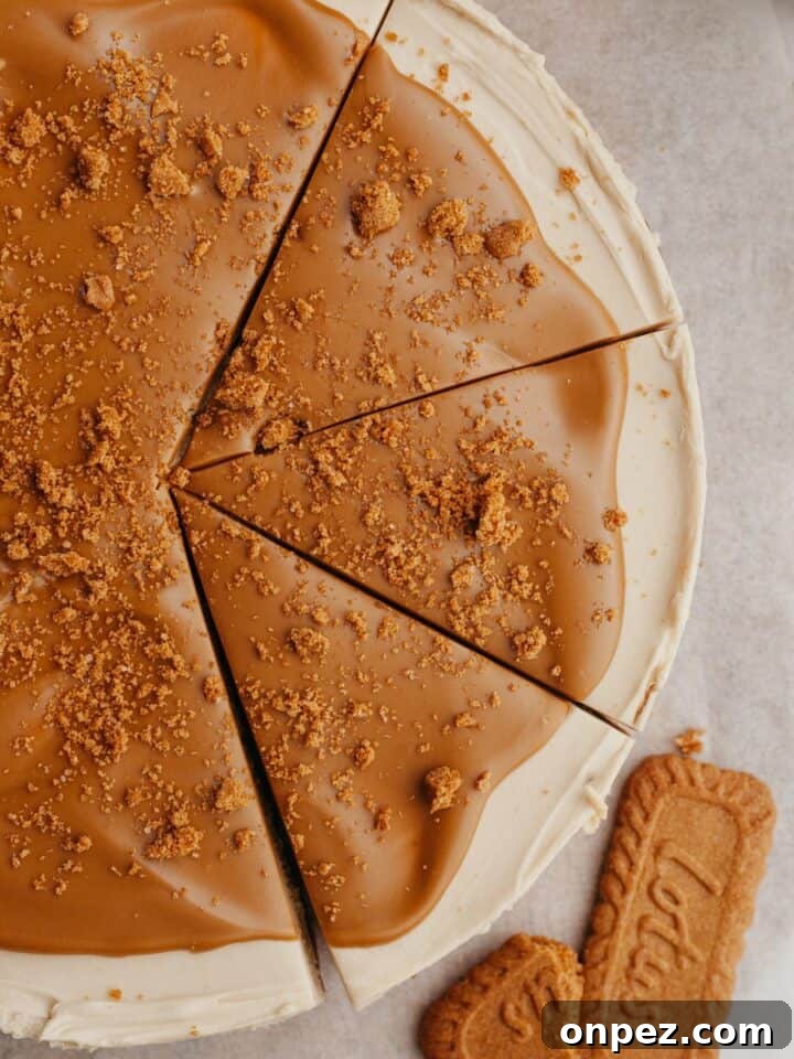 A biscoff cheesecake with 3 slices cut.