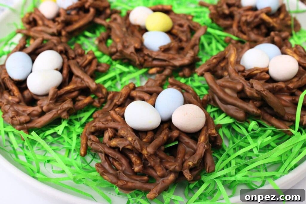 Microwave Easter Bird's Nest Haystacks Recipe 9 closeup view of chocolate butterscotch birds nest treats on a bed of fake Easter grass