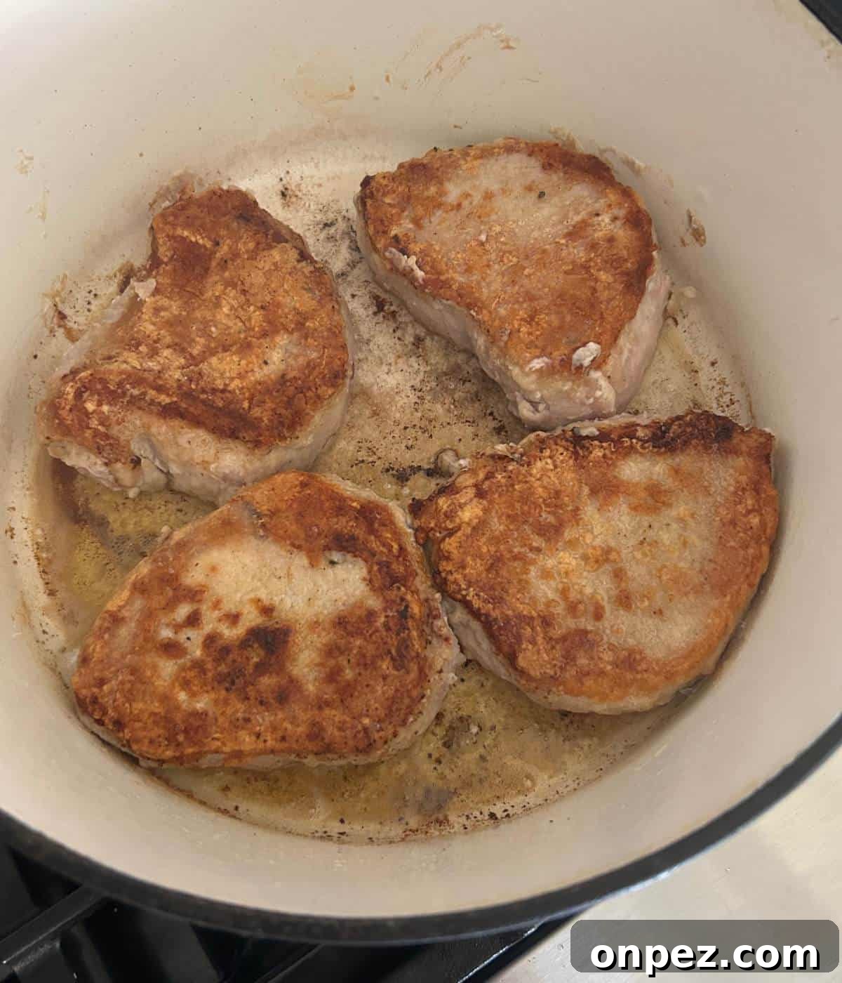 Dutch Oven Pork Chops with Tender Gravy 6 Pan searing pork chops in dutch oven.