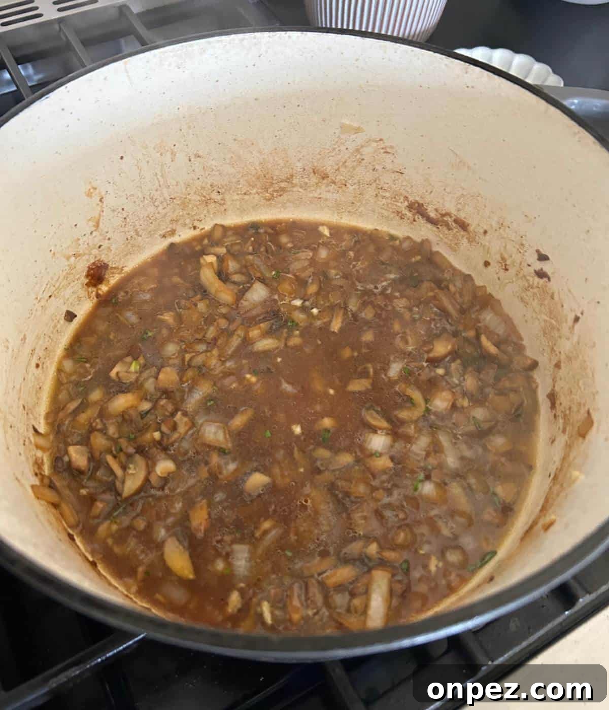 Dutch Oven Pork Chops with Tender Gravy 9 Beef stock with mushrooms and onions.