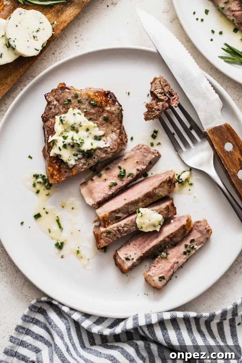 A sliced steak showing a well done interior.