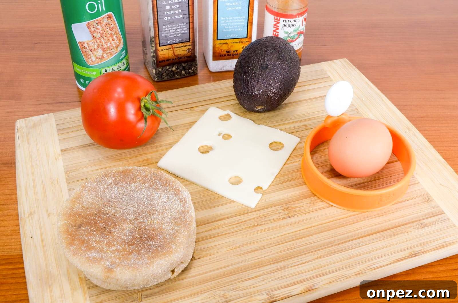 Breakfast Sandwich with Egg, Avocado, Tomato, and Swiss Cheese Breakfast Sandwich with Egg, Avocado, Tomato, and Swiss Cheese