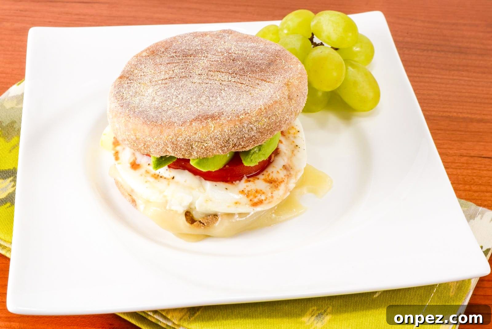 Breakfast Sandwich with Egg, Avocado, Tomato, and Swiss Cheese Breakfast Sandwich with Egg, Avocado, Tomato, and Swiss Cheese