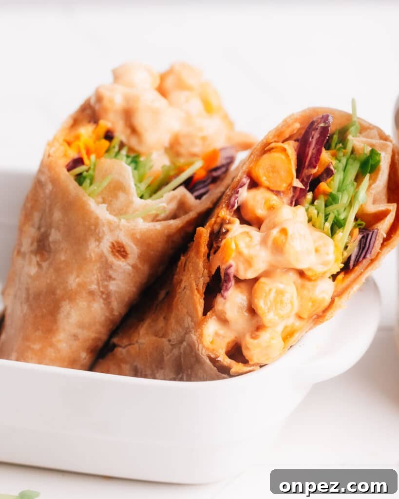 Spicy Vegan Buffalo Chickpea Wrap Recipe 2 Buffalo chickpea wraps in a dish.