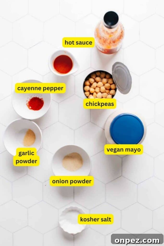 Spicy Vegan Buffalo Chickpea Wrap Recipe 3 Ingredients for buffalo chickpea wrap laid out on a kitchen countertop.